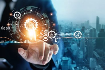 Industry 4.0, Businessman touching brain in cogwheel, Innovative and futuristic, Business process workflow development and optimisation of construction industrial on city background.